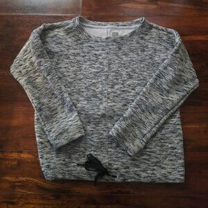 black, grey, and white light sweater type thing